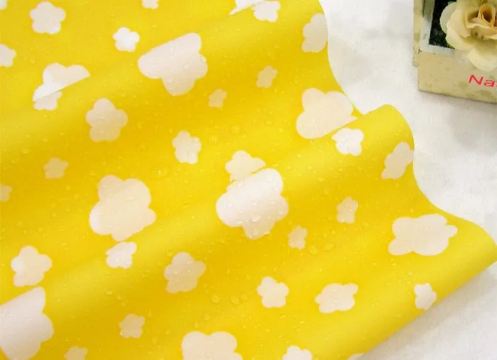Waterproof Fabric Clouds on Yellow per Yard 30366